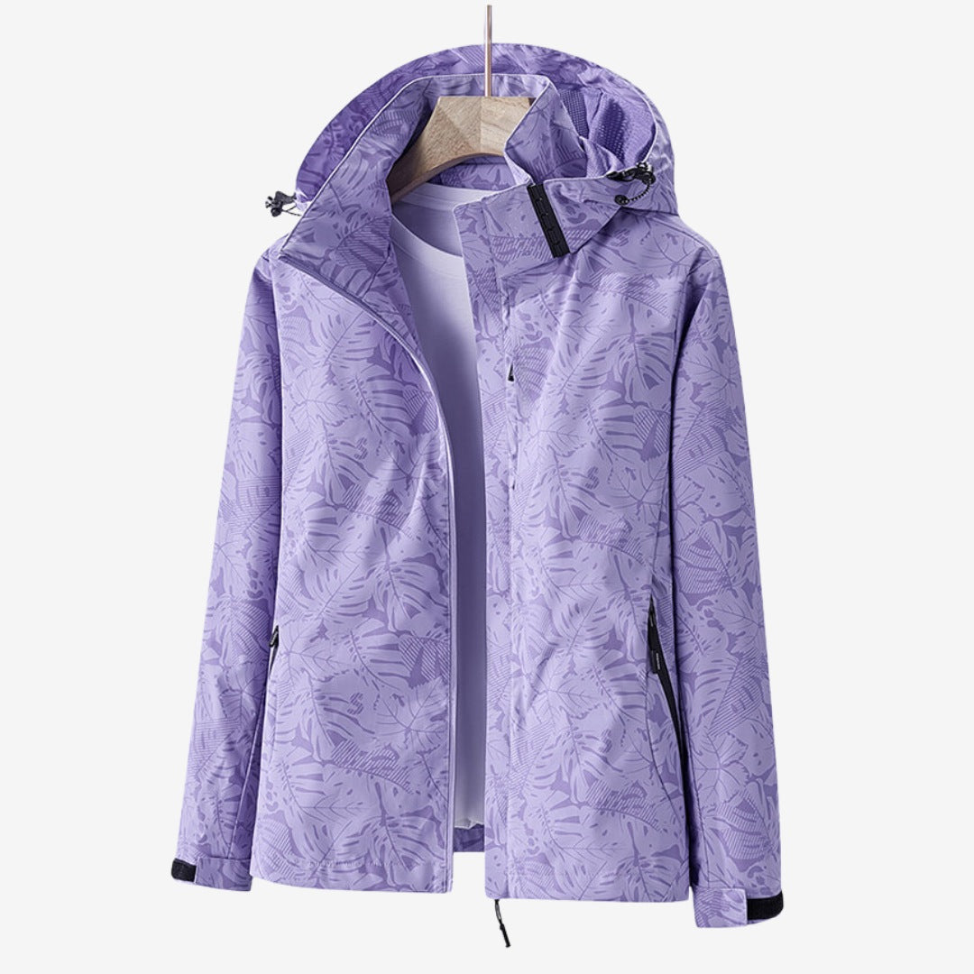Women's waterproof wind jacket with a leaf print and hood - lilac