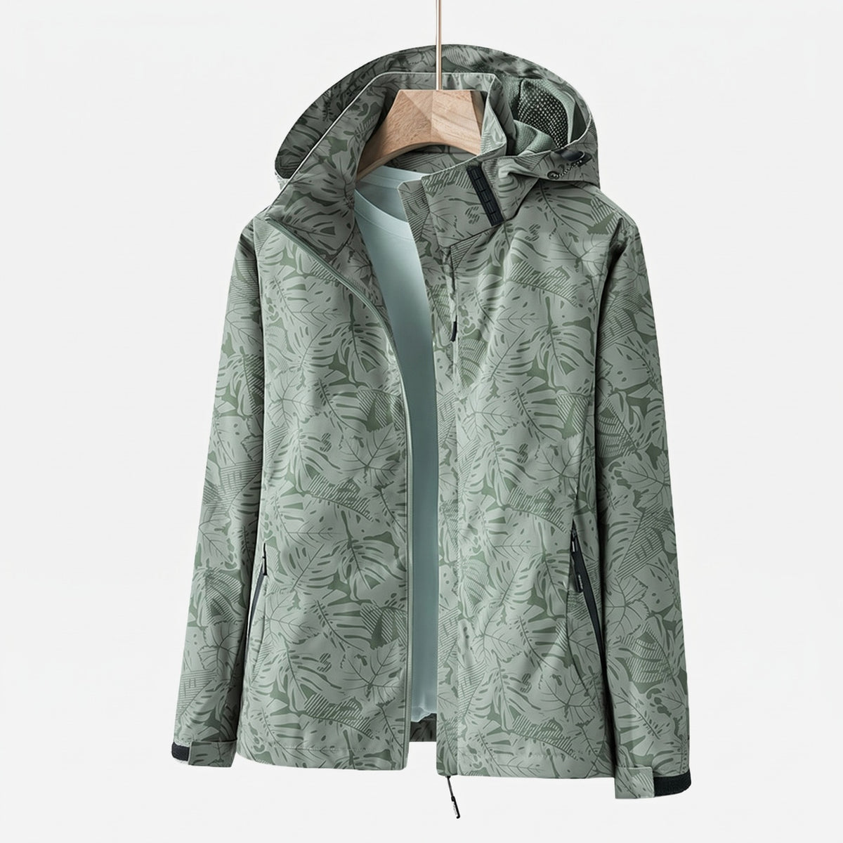 Women's waterproof wind jacket with a leaf print and hood - sage green