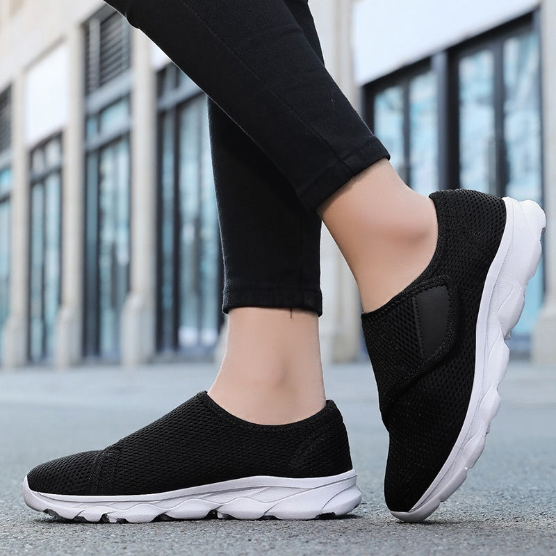 Wide fit mesh shoes for women with broad hook and loop strap over the instep and flat tread sole - view 10