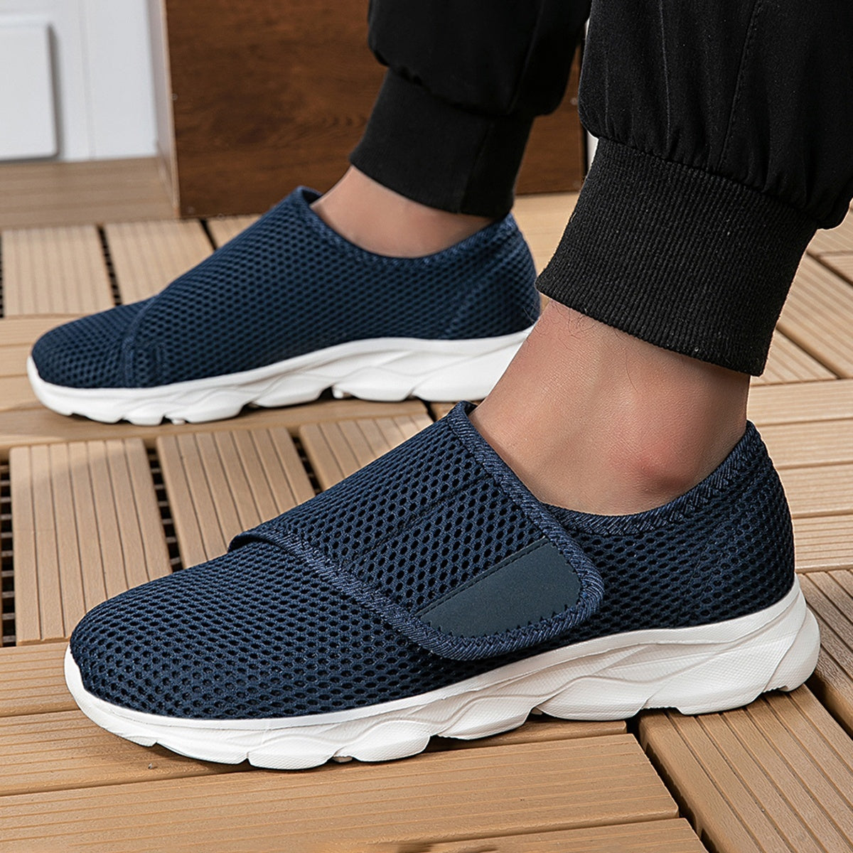 Wide fit mesh shoes for women with broad hook and loop strap over the instep and flat tread sole - navy