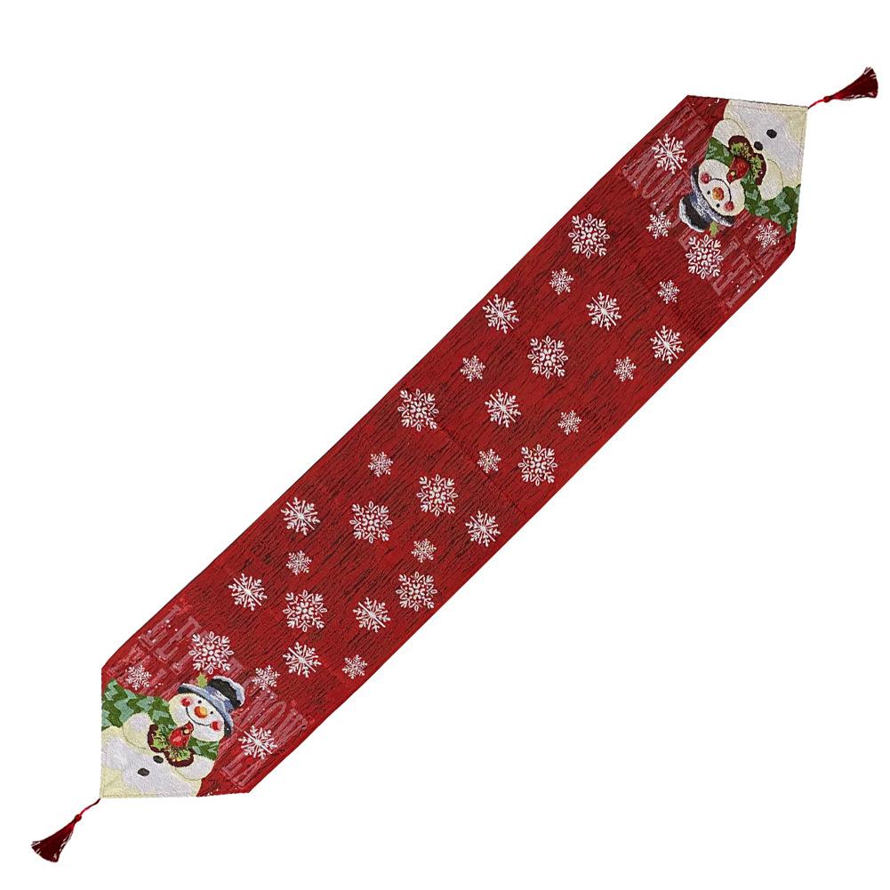 Woven Christmas table runner with a snowman at the point, snowflakes and a tassel