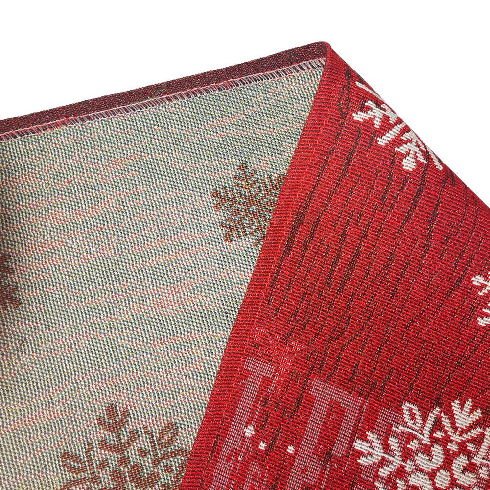 Woven Christmas table runner with a snowman at the point, snowflakes and a tassel