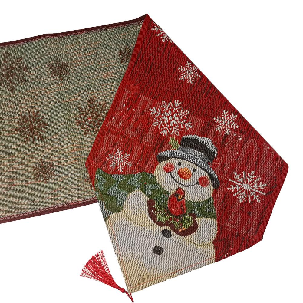 Woven Christmas table runner with a snowman at the point, snowflakes and a tassel
