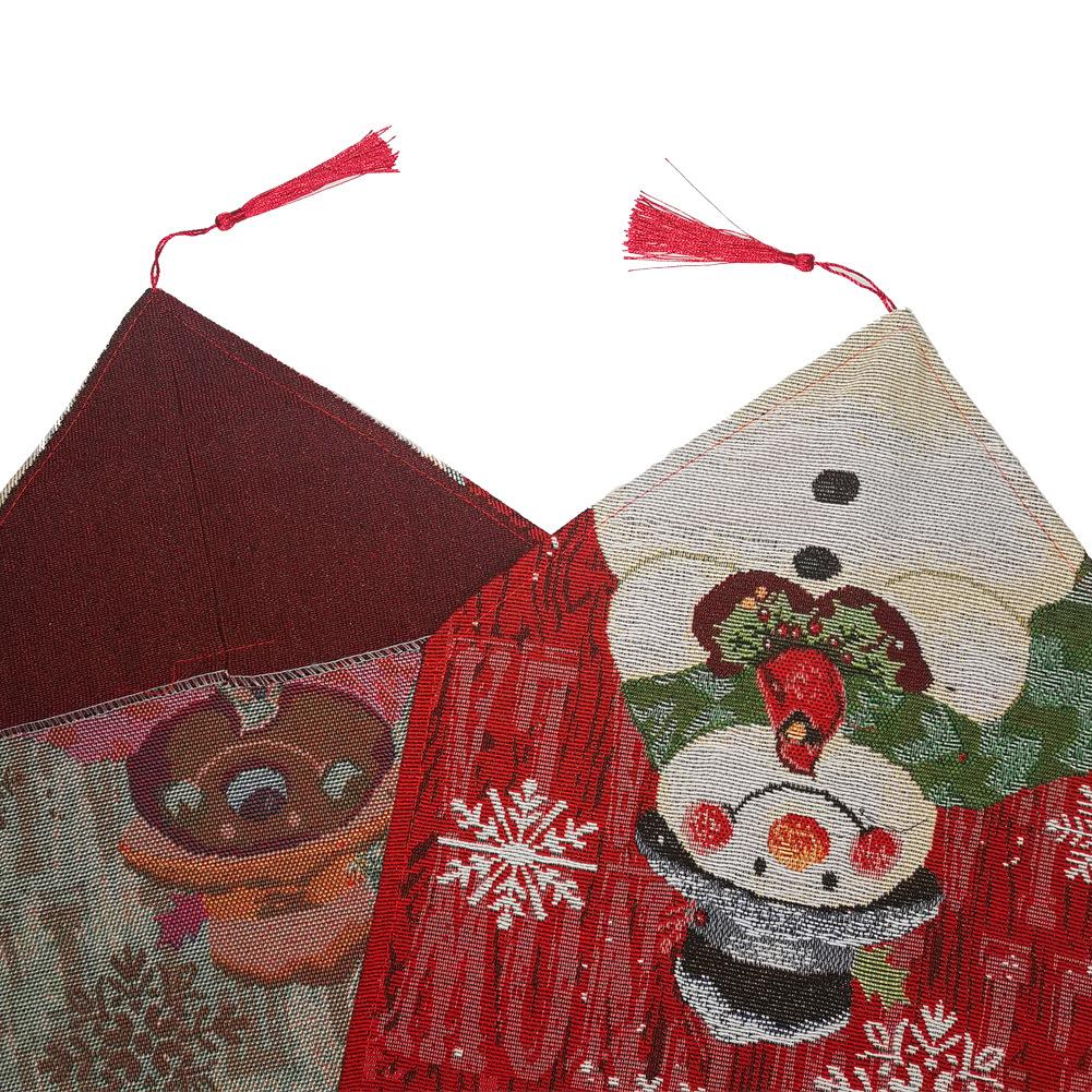 Woven Christmas table runner with a snowman at the point, snowflakes and a tassel