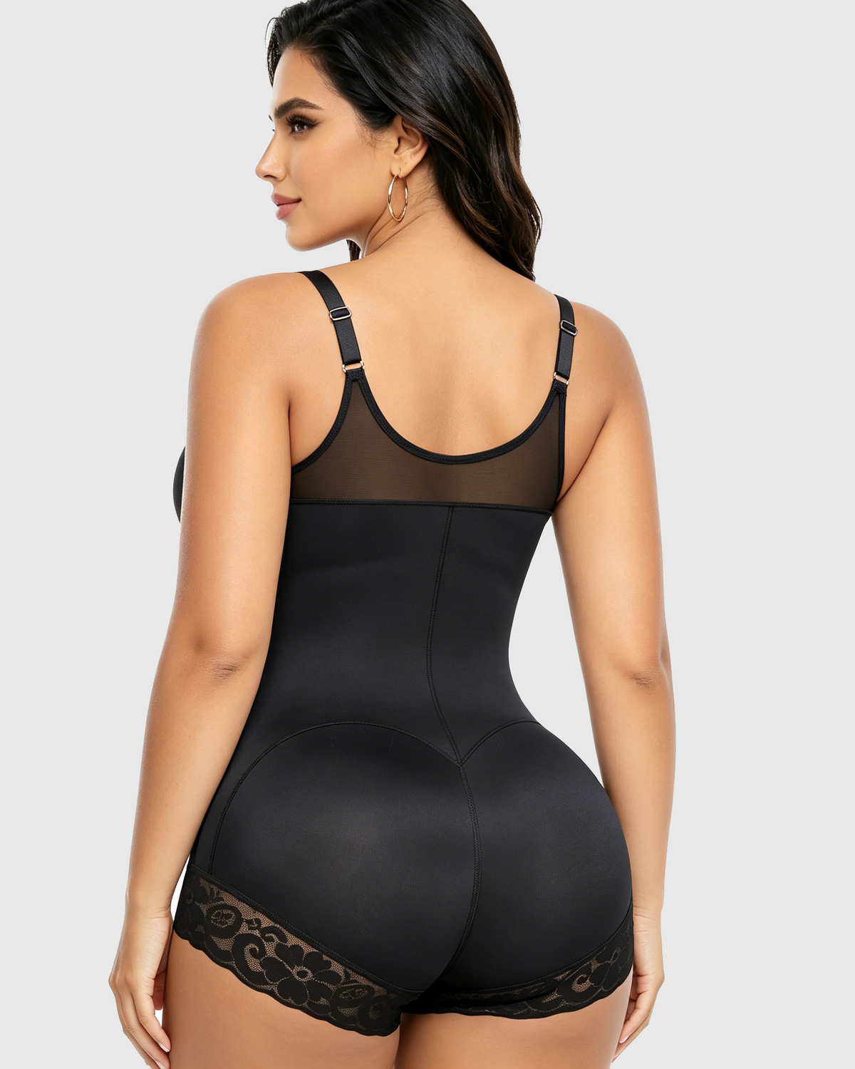 Zip-front shapewear bodysuit with a V-neck and lace-trimmed legs